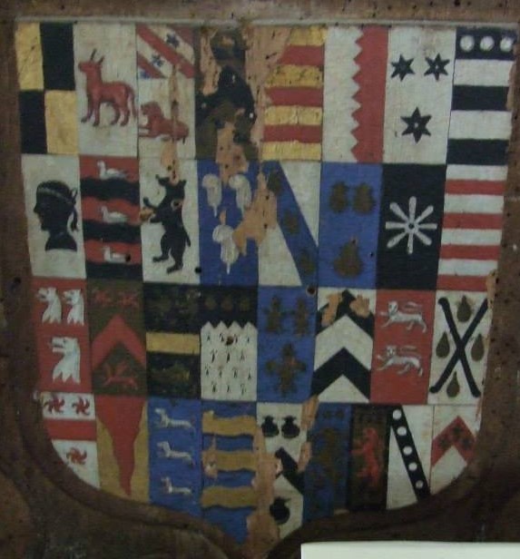 A Cornish coat of arms (left half of the shield) beside the coat of arms of a Devon family.